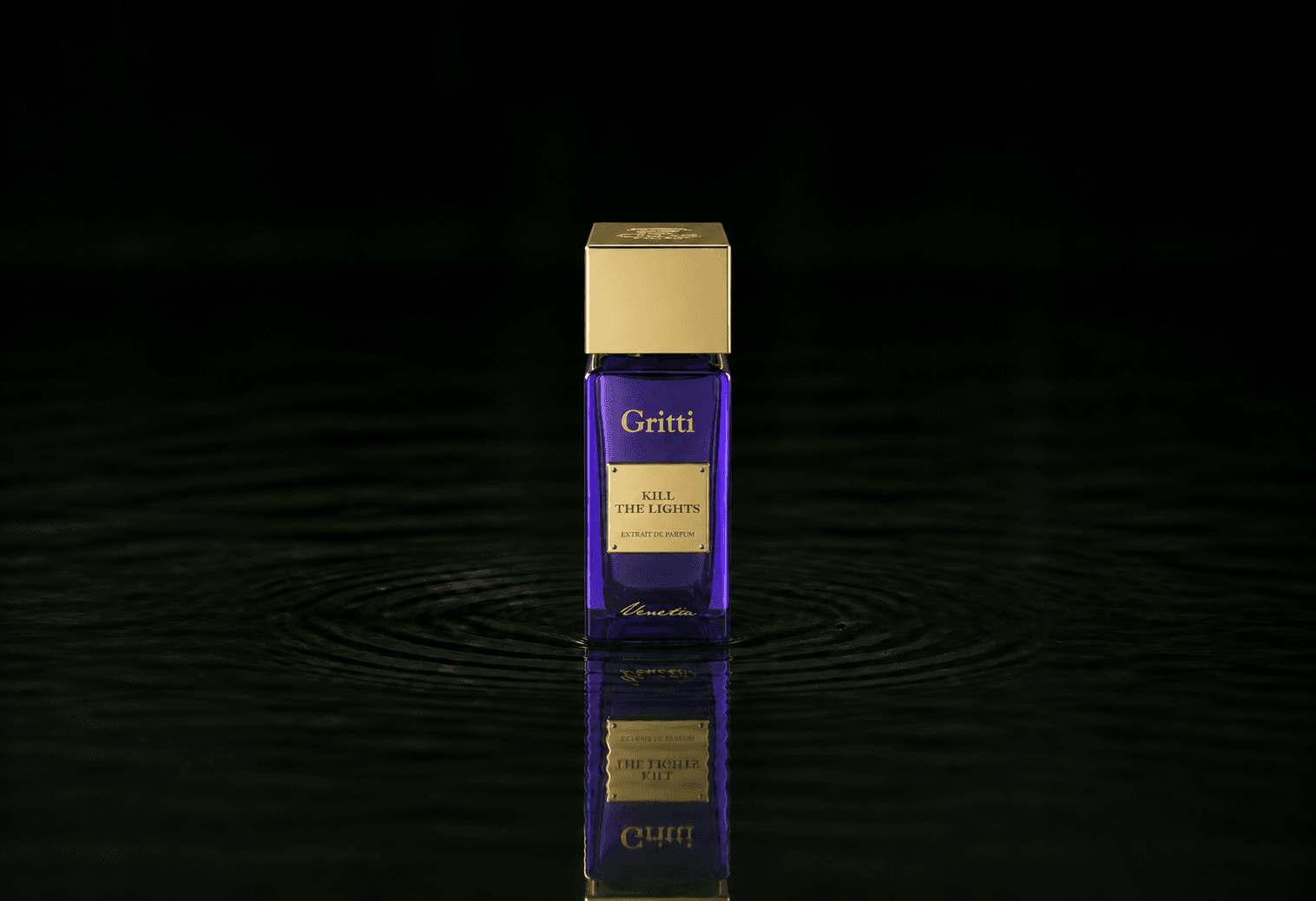 Gritti Kill The Lights Extrait fragrance bottle floating above dark water