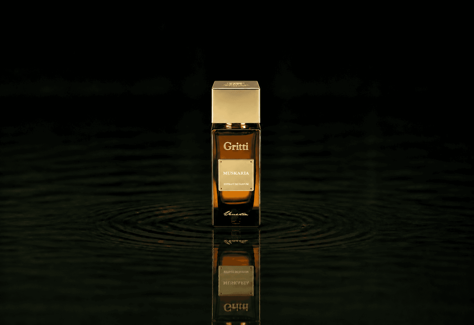 Gritti Muskaria fragrance bottle floating above dark water