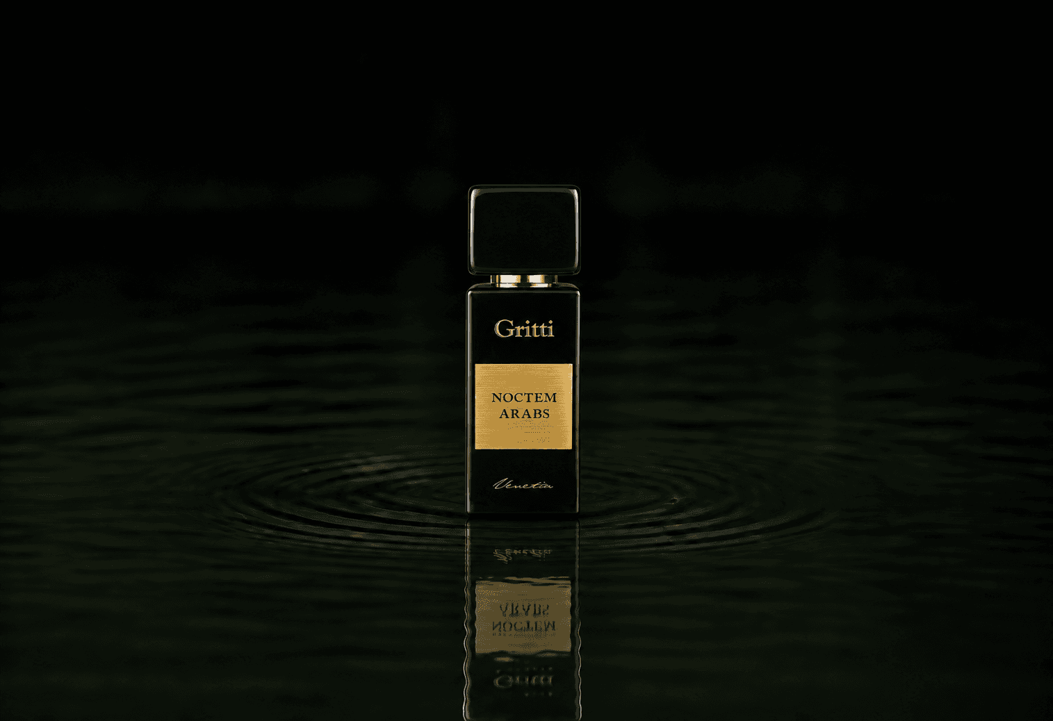 Gritti Noctem Arabs fragrance bottle floating above dark water