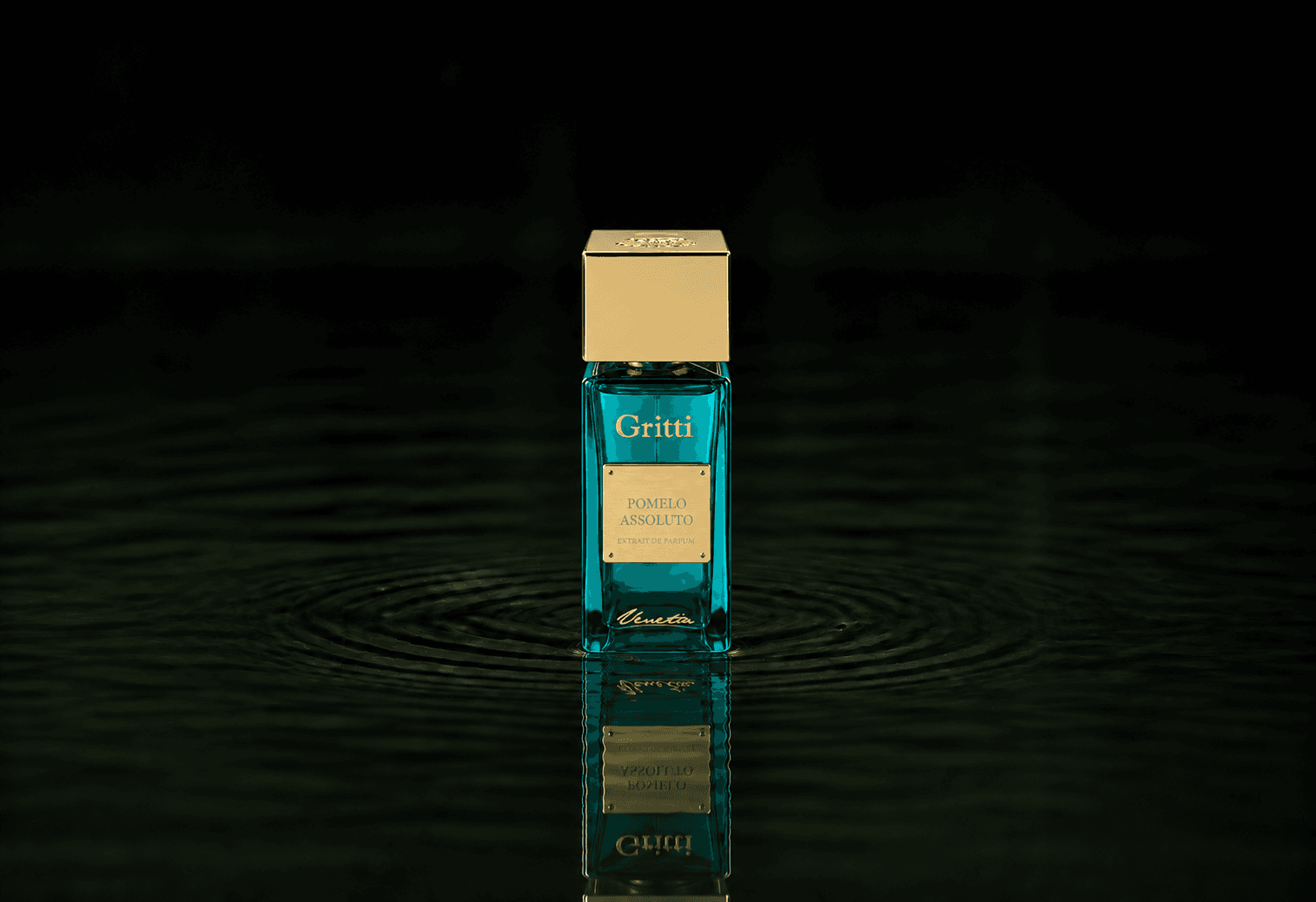 Gritti Pomelo Assoluto fragrance bottle floating above dark water