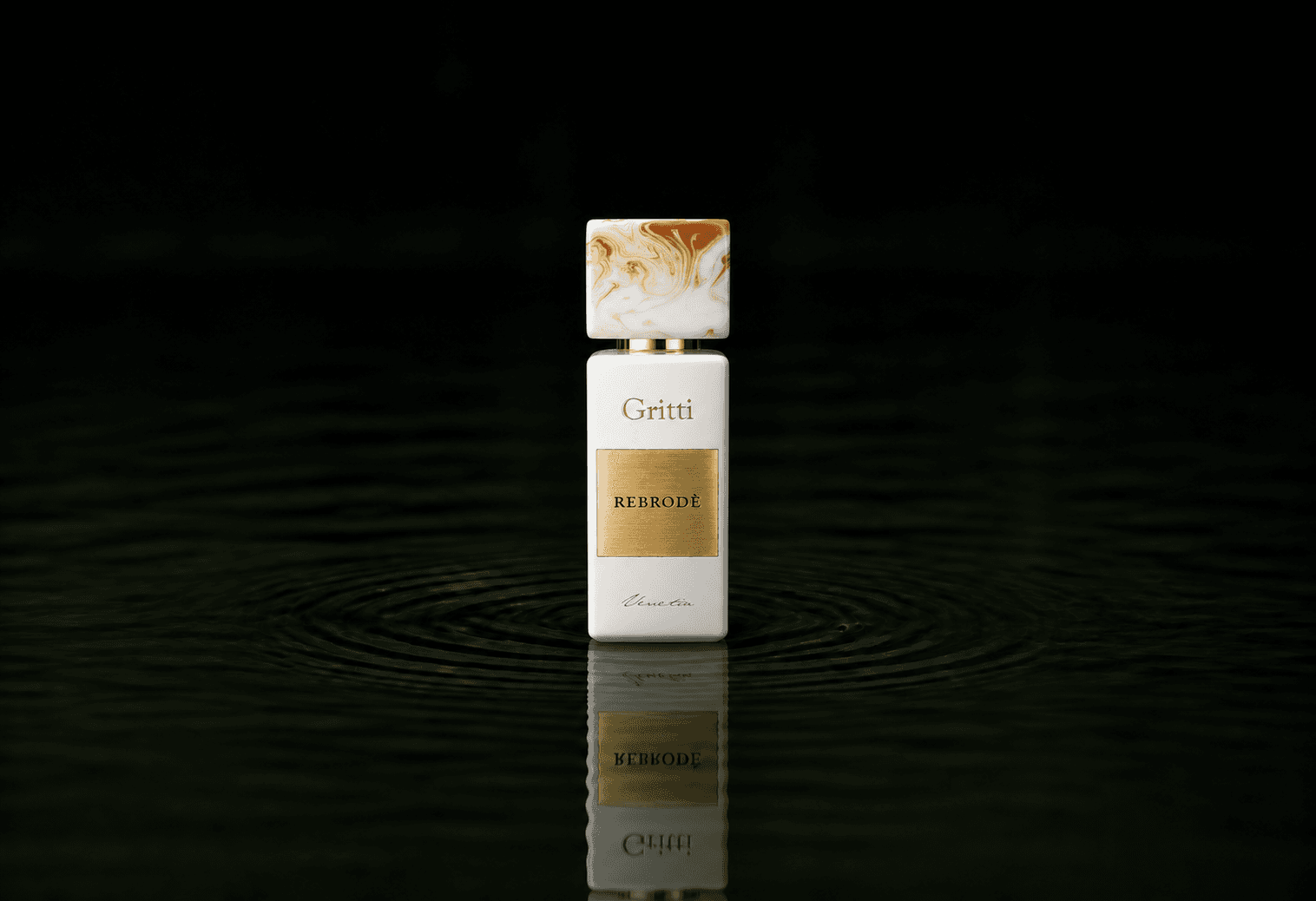 Gritti Rebrode fragrance bottle floating above dark water