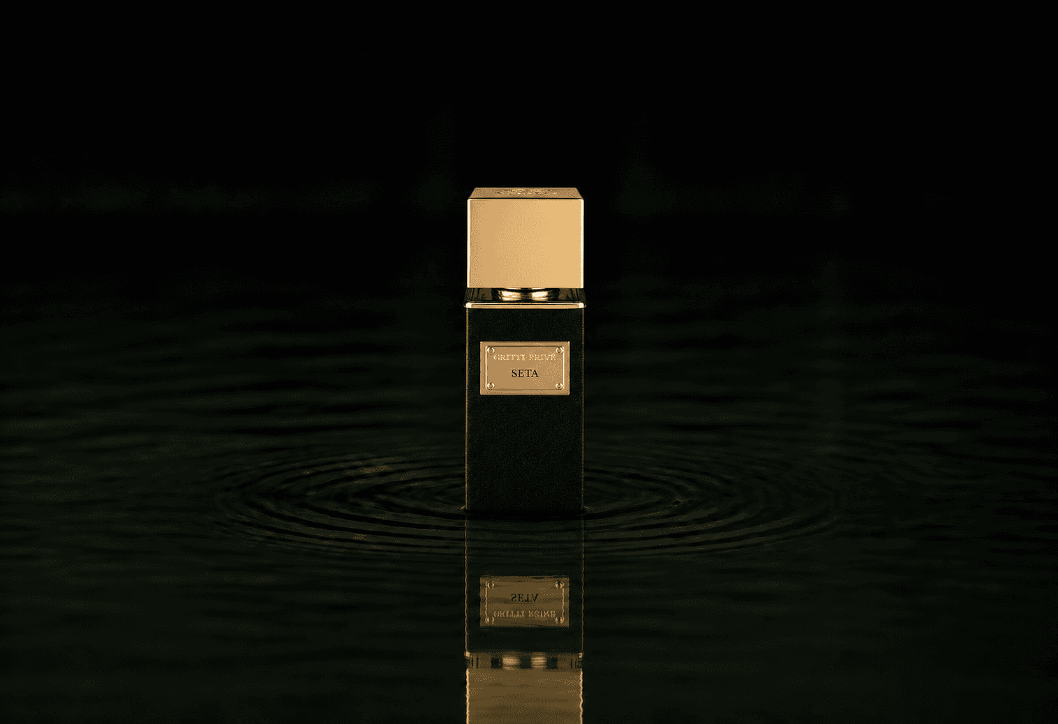 Gritti Seta fragrance bottle floating above dark water