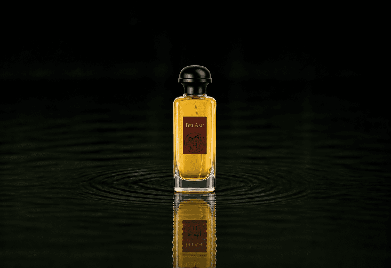 Hermes Bel Ami fragrance bottle floating above dark water