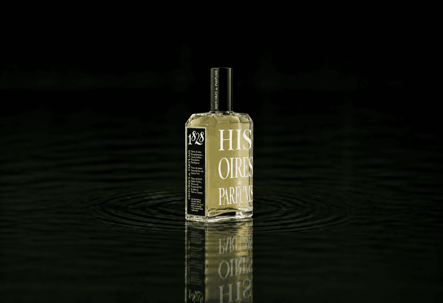 Histoires de Parfums Klassik Kollektion - 1828 fragrance bottle floating above dark water