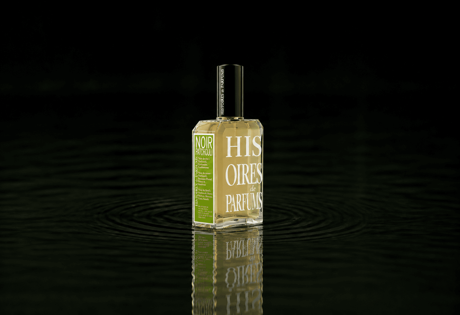 Histoires de Parfums Noir Patchouli fragrance bottle floating above dark water