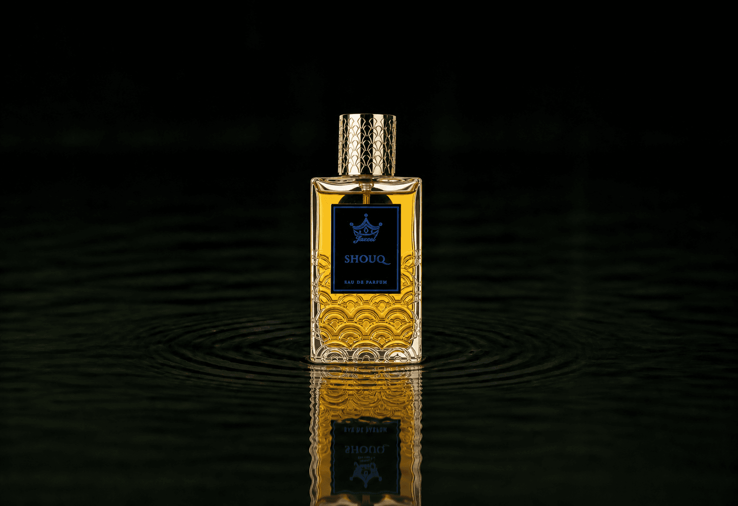 Jazeel Shouq fragrance bottle floating above dark water