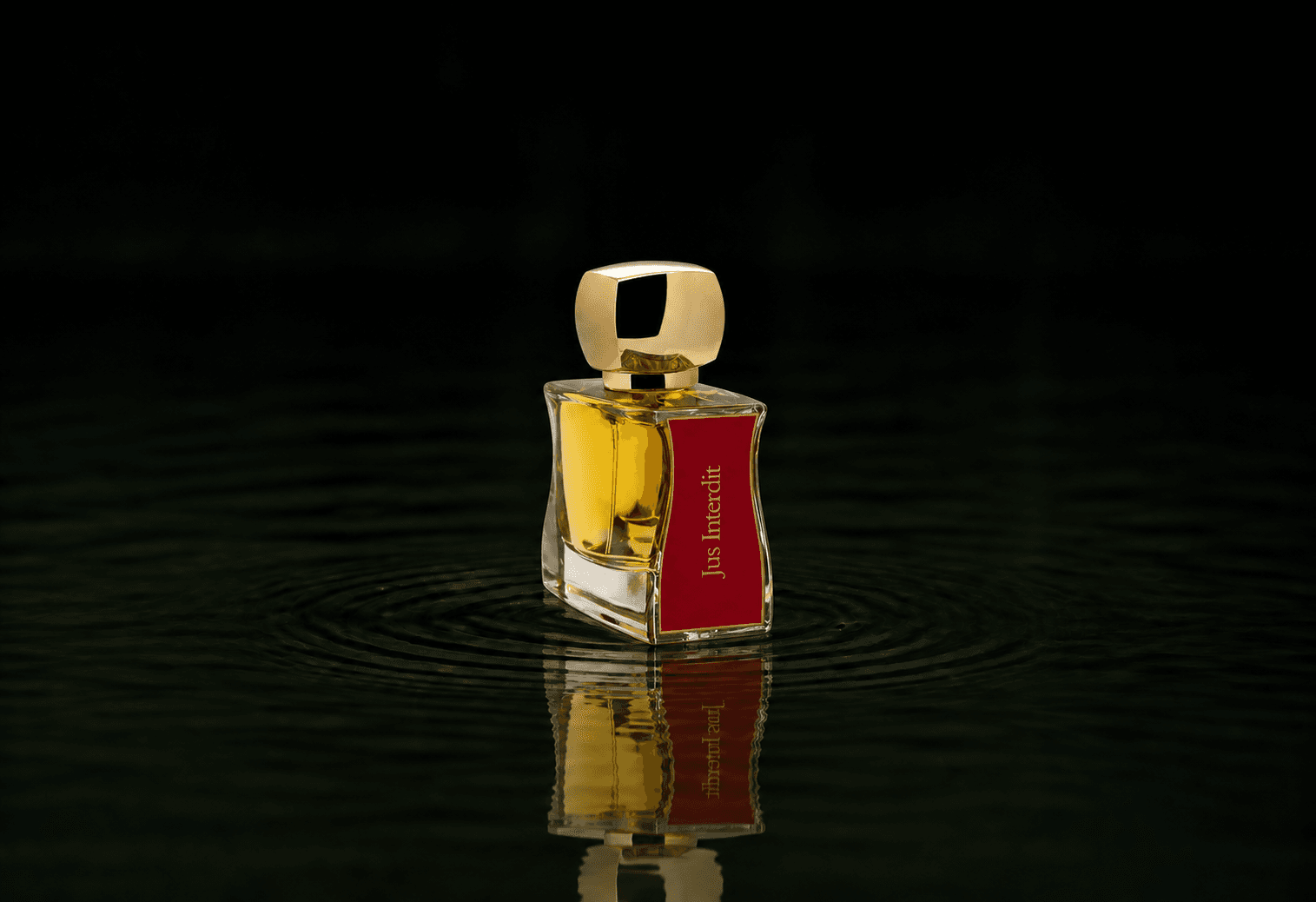 Jovoy Jus Interdit - EDP Extrait fragrance bottle floating above dark water