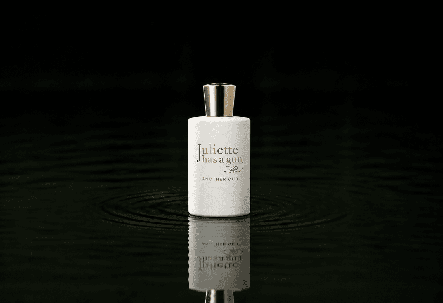 Juliette Has A Gun Another Oud fragrance bottle floating above dark water