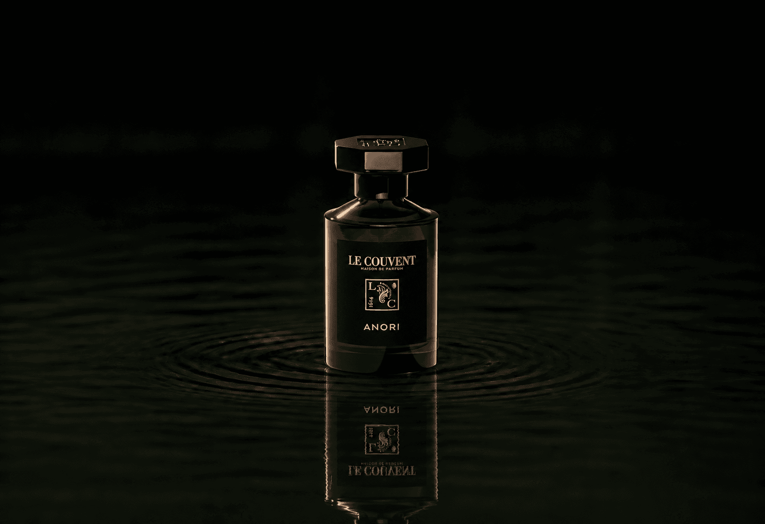Le Couvent Maison Remarquable Anori fragrance bottle floating above dark water