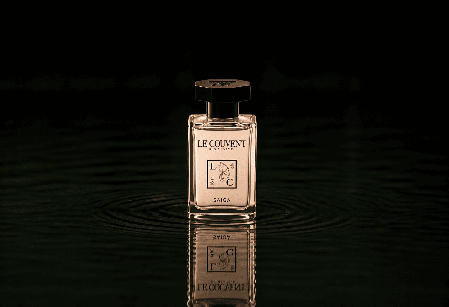 Le Couvent Maison Singulieres Saiga fragrance bottle floating above dark water