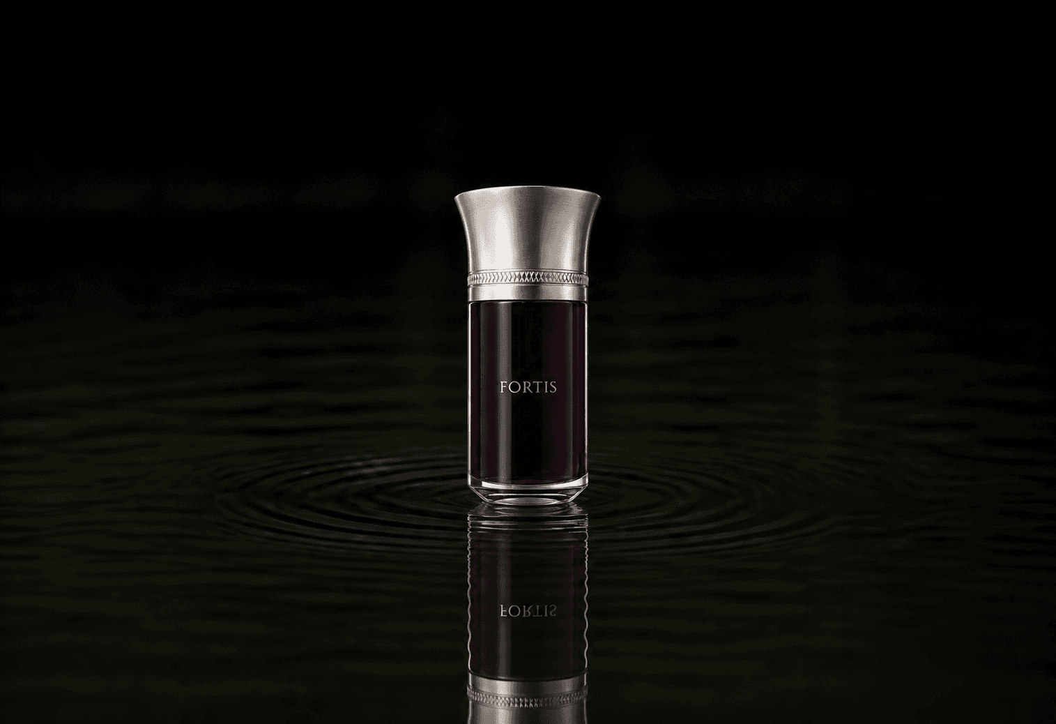 Les Liquides Imaginaires Fortis fragrance bottle floating above dark water
