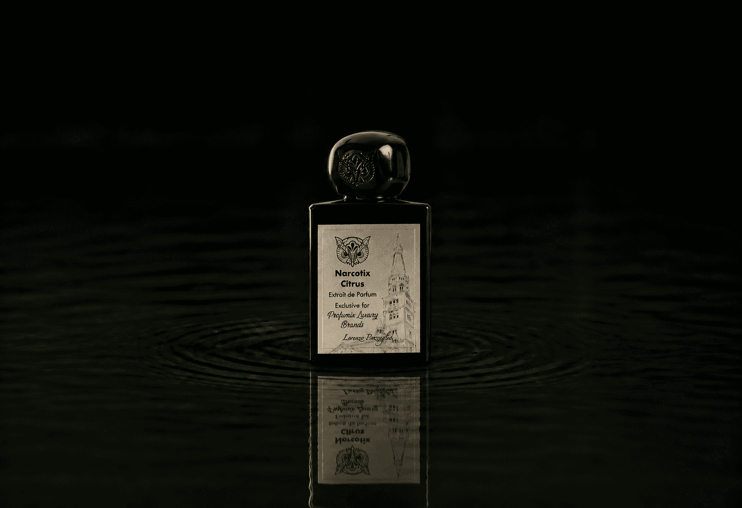 Lorenzo Pazzaglia Narcotix Citrus fragrance bottle floating above dark water