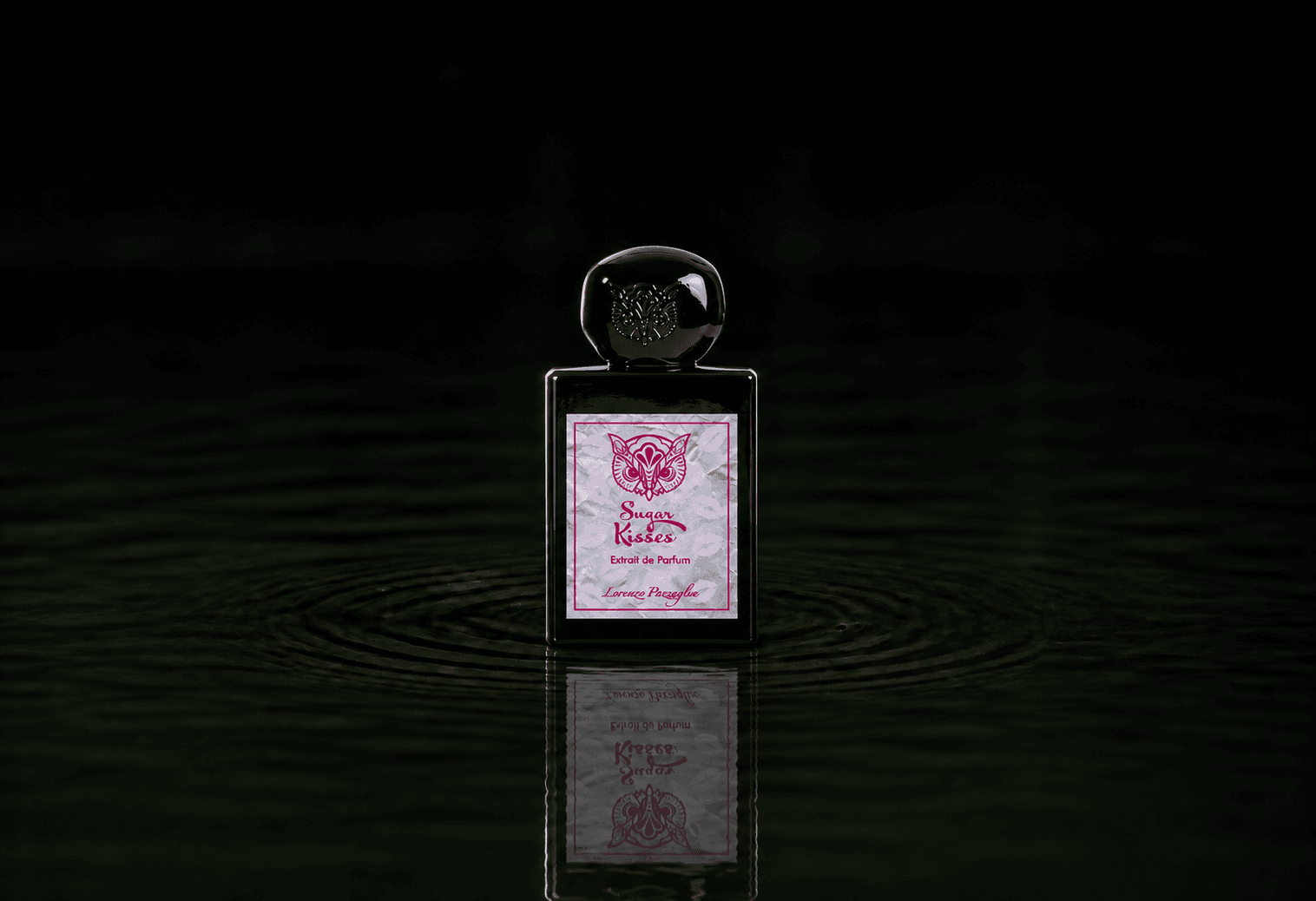 Lorenzo Pazzaglia Sugar Kisses fragrance bottle floating above dark water