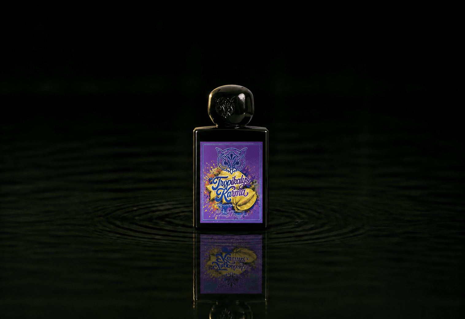 Lorenzo Pazzaglia Tropikalys Karma fragrance bottle floating above dark water