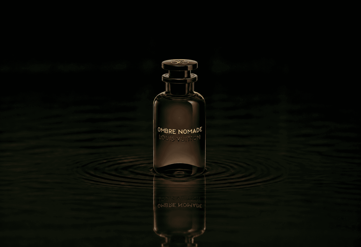 Louis Vuitton Ombre Nomade fragrance bottle floating above dark water