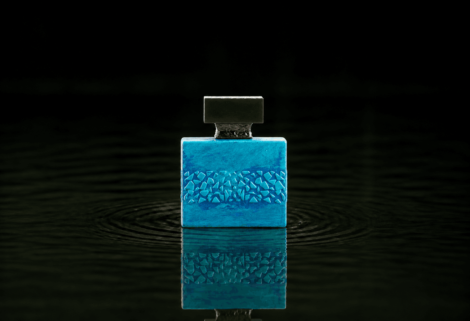 M.Micallef Edenfalls fragrance bottle floating above dark water