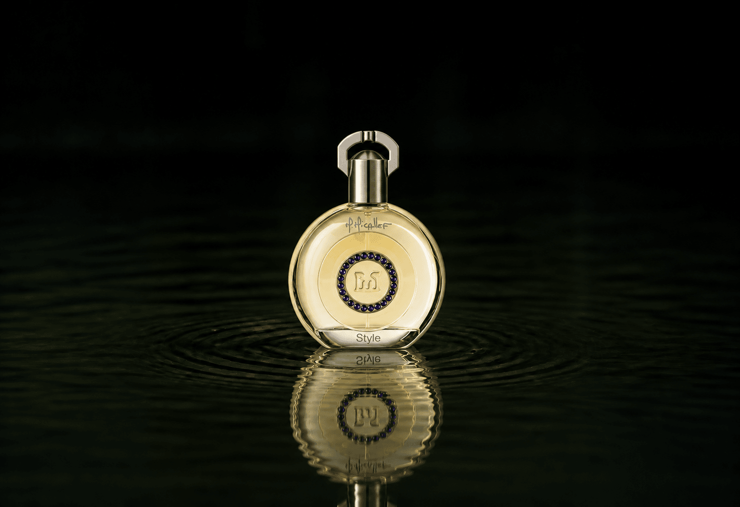 M.Micallef Exclusif Style fragrance bottle floating above dark water