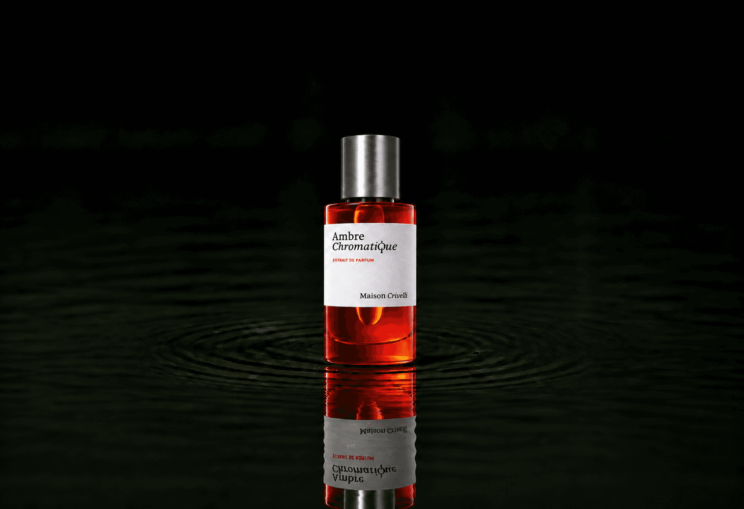 Maison Crivelli Ambre chromatique fragrance bottle floating above dark water