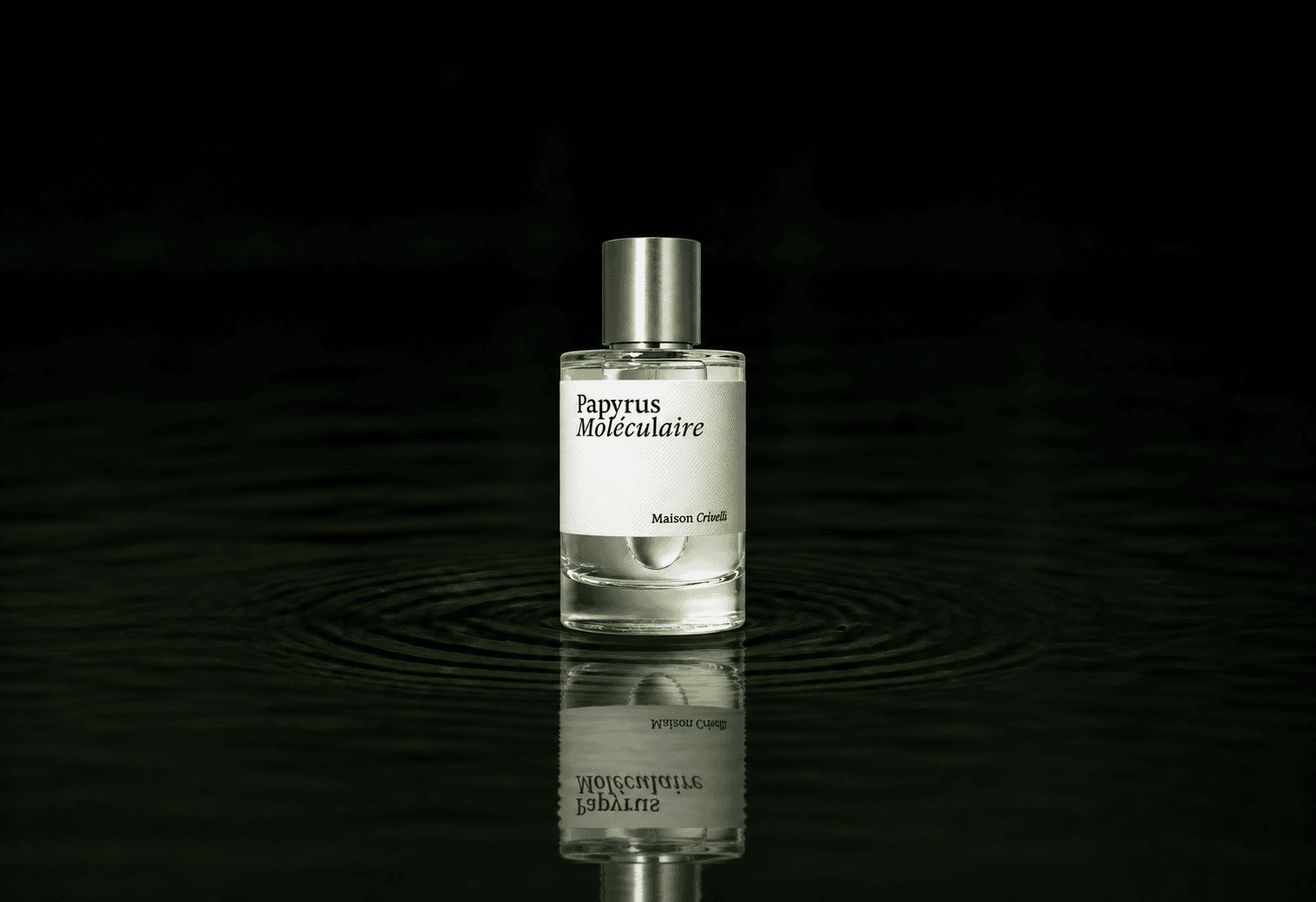 Maison Crivelli Papyrus Moleculaire fragrance bottle floating above dark water