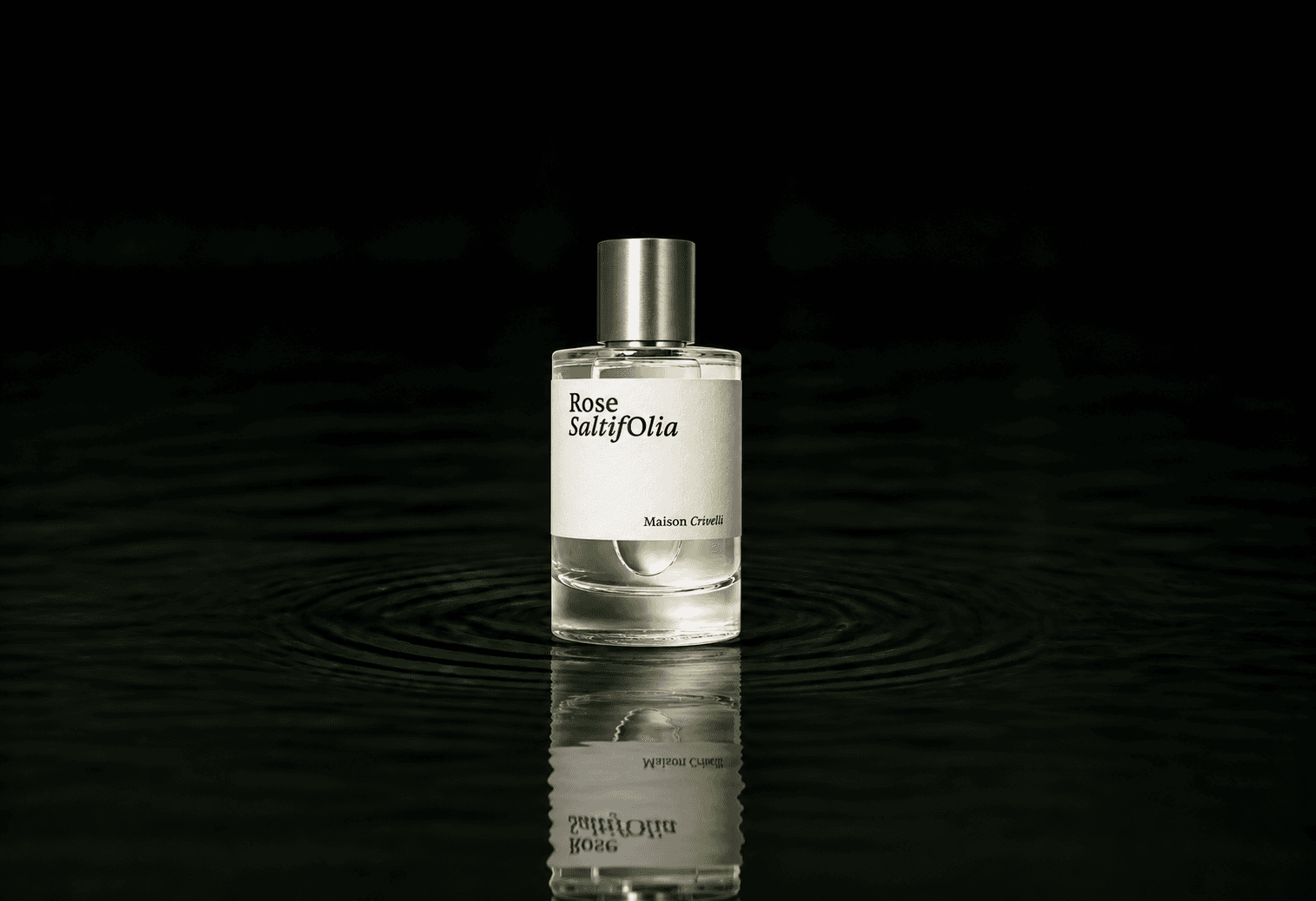Maison Crivelli Rose Satifolia fragrance bottle floating above dark water