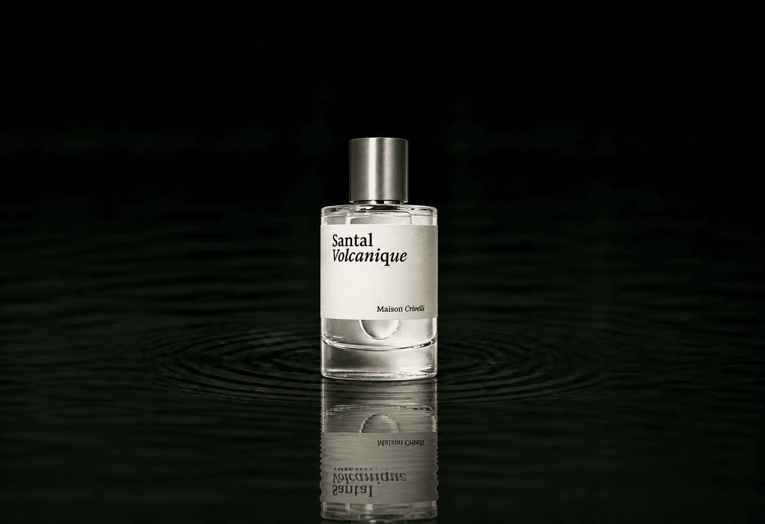 Maison Crivelli Santal Volcanique fragrance bottle floating above dark water
