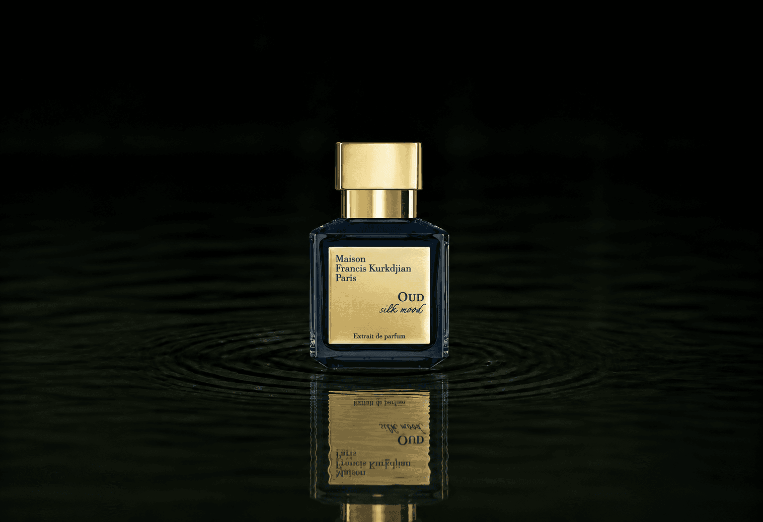 Maison Francis Kurkdjian OUD - Silk mood fragrance bottle floating above dark water