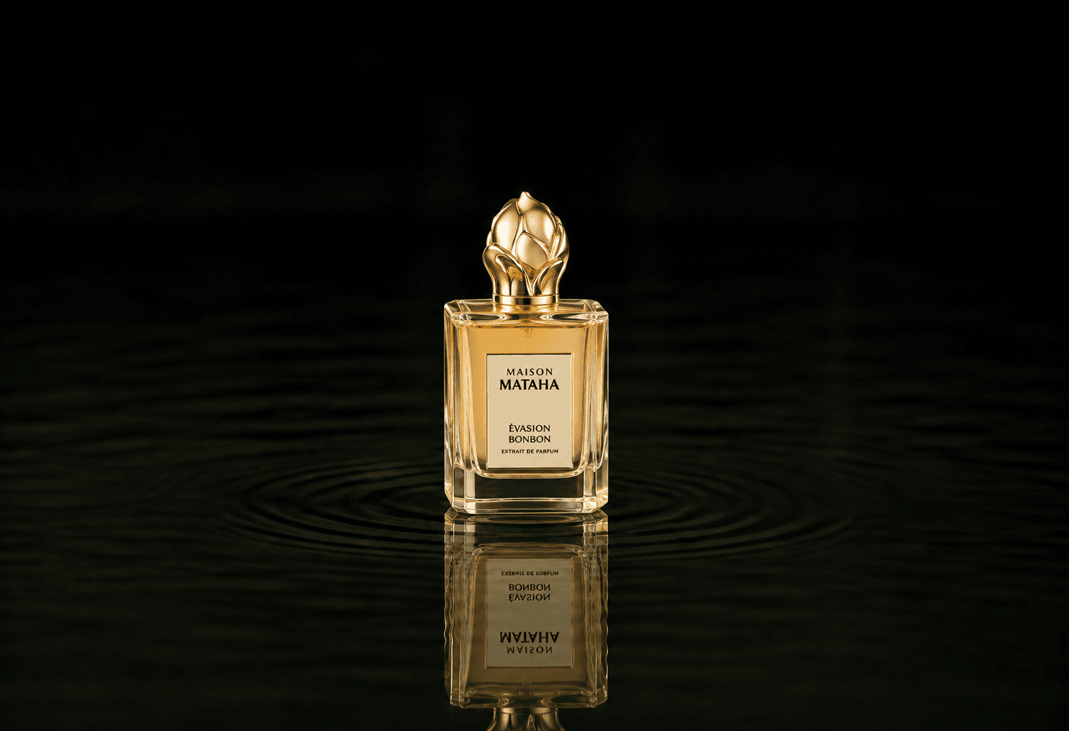 Maison Mataha Evasion bonbon fragrance bottle floating above dark water