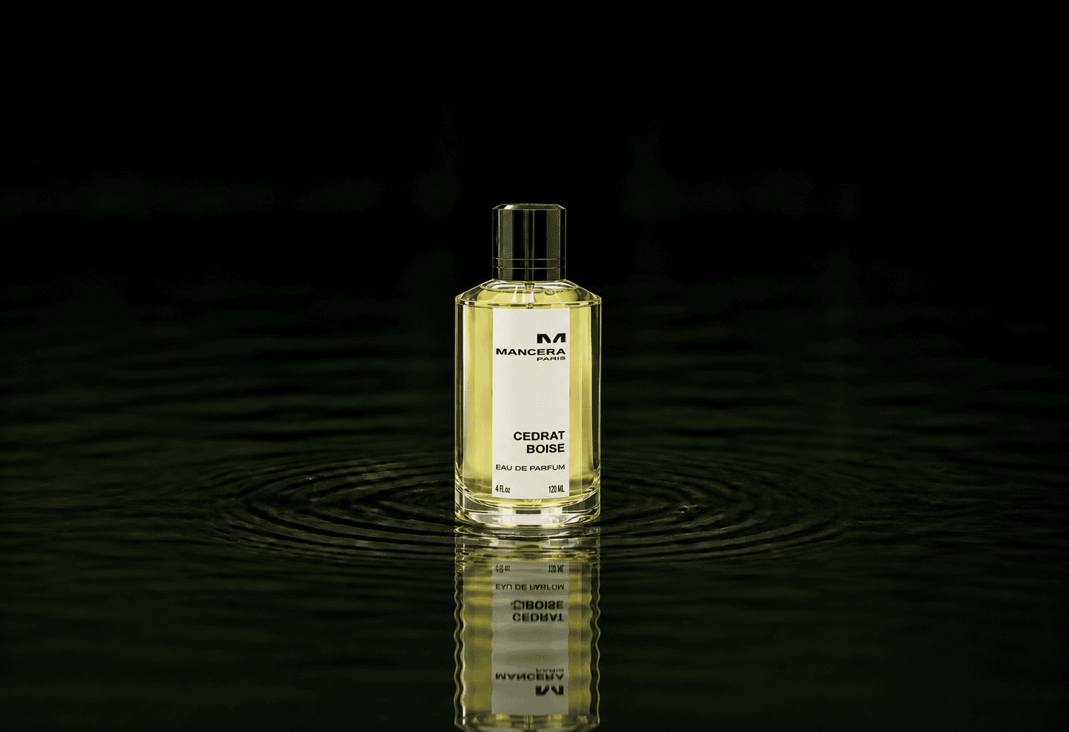 Mancera Cedrat Boise fragrance bottle floating above dark water
