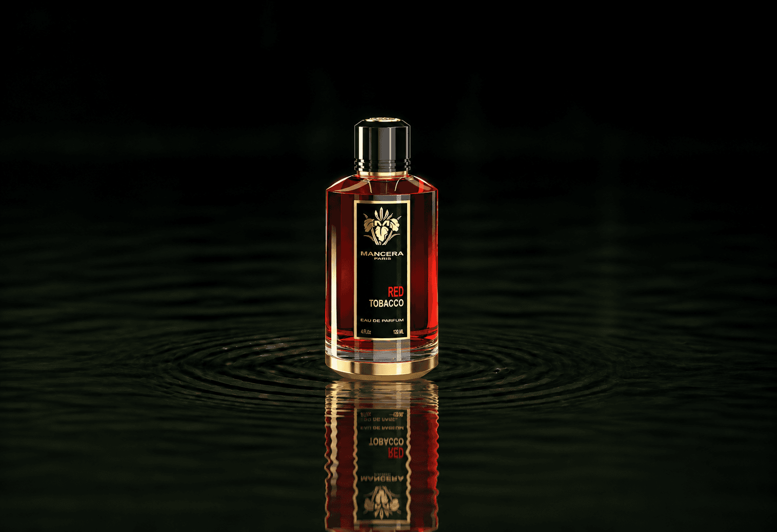 Mancera Red Tobacco fragrance bottle floating above dark water