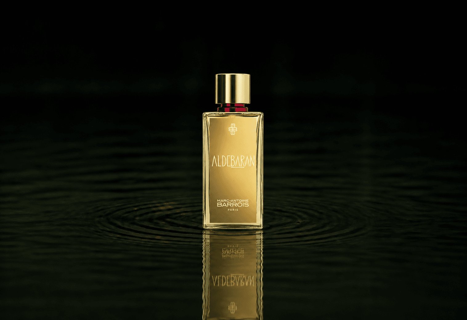 Marc-Antoine Barrois Aldebaran fragrance bottle floating above dark water