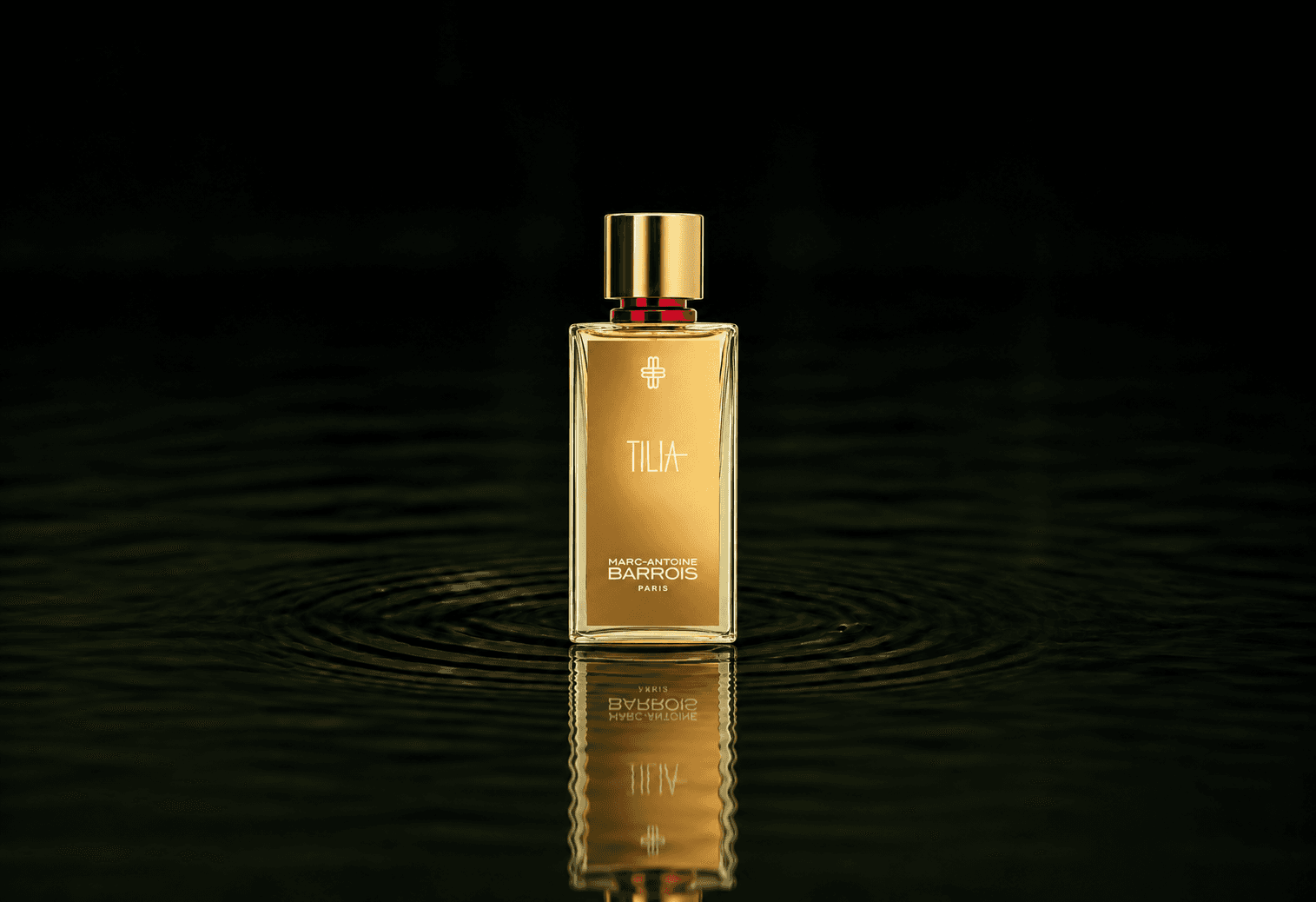 Marc-Antoine Barrois Tilia fragrance bottle floating above dark water