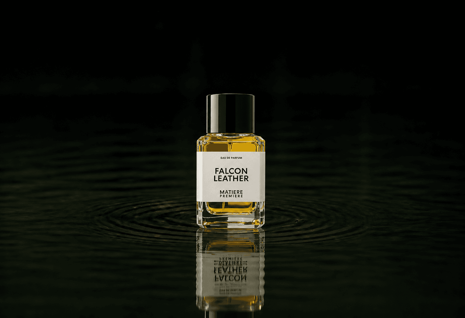 Matiere Premiere Falcon Leather fragrance bottle floating above dark water