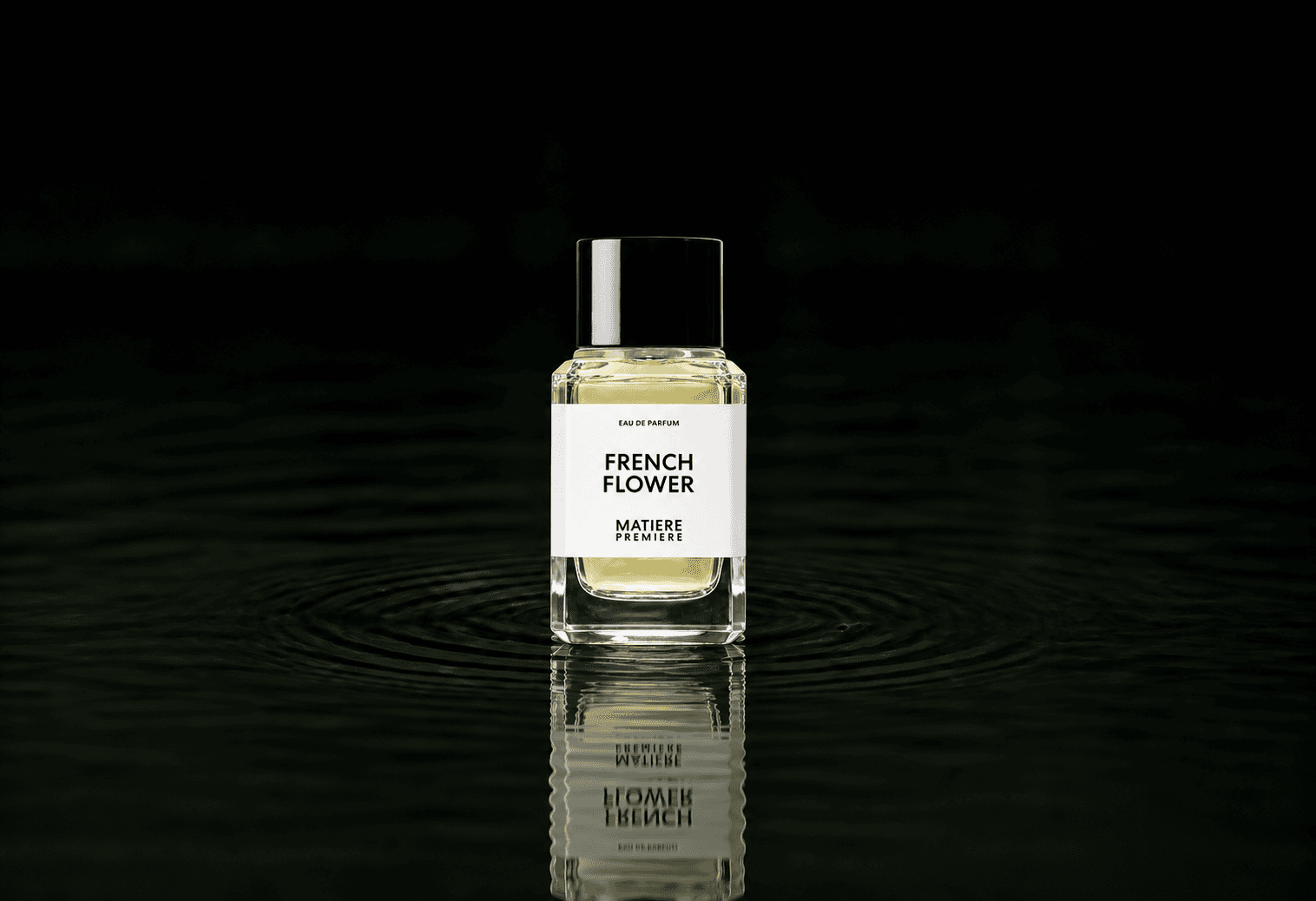 Matiere Premiere French Flower fragrance bottle floating above dark water