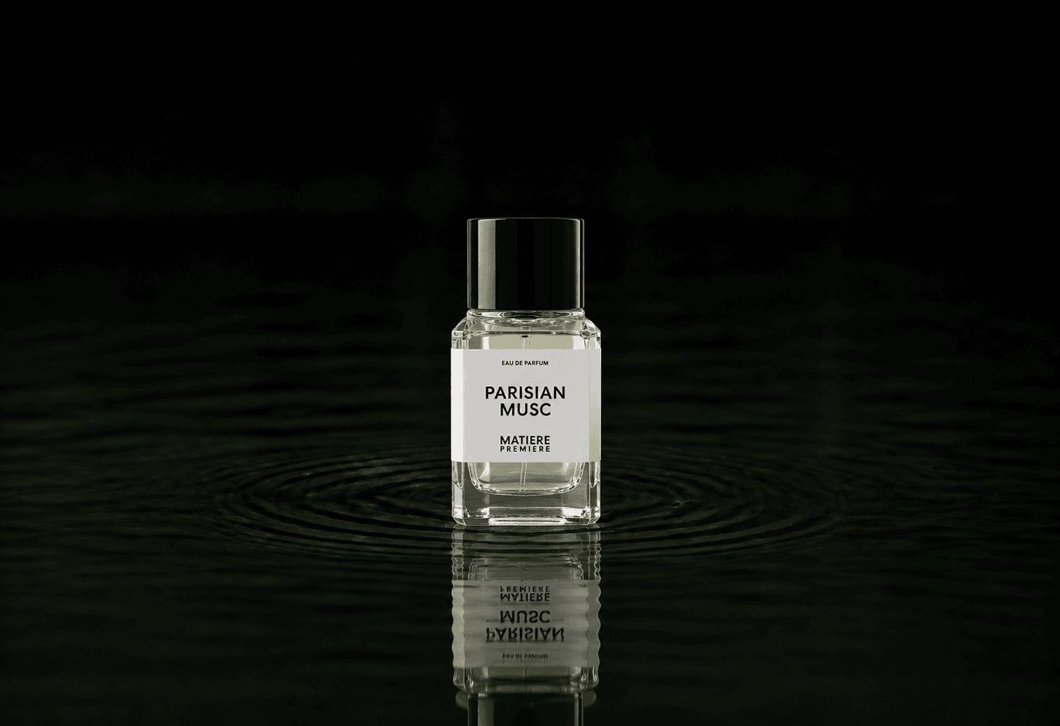 Matiere Premiere Parisian Musc fragrance bottle floating above dark water
