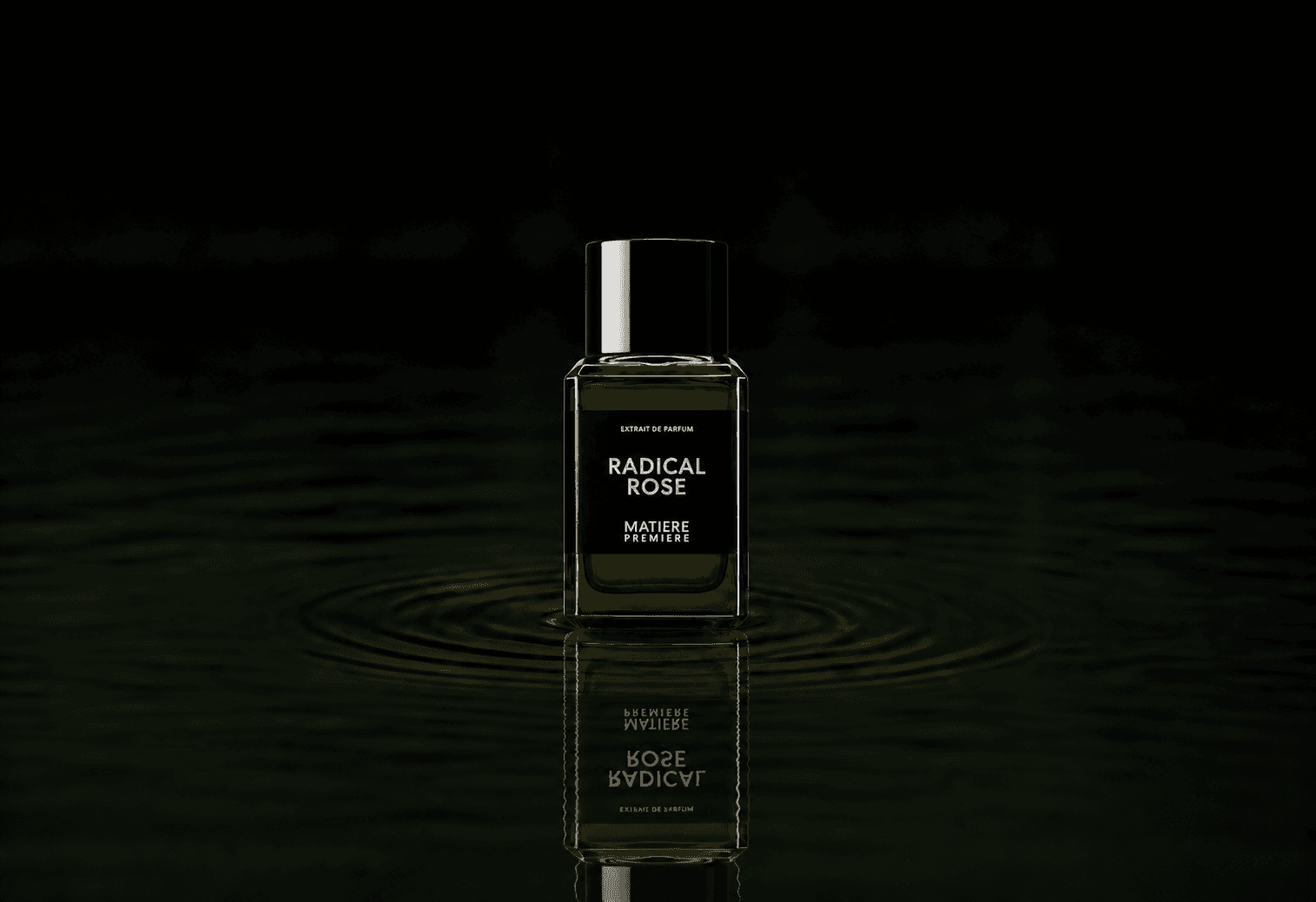 Matiere Premiere Radical Rose Extrait fragrance bottle floating above dark water