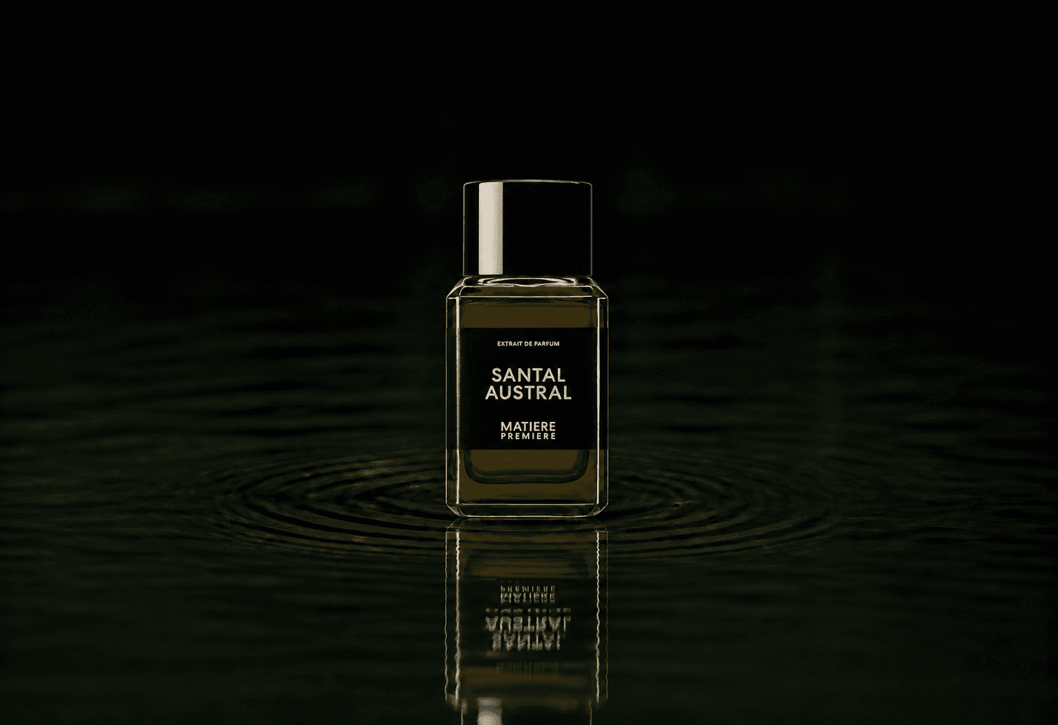 Matiere Premiere Santal Austral Extrait fragrance bottle floating above dark water