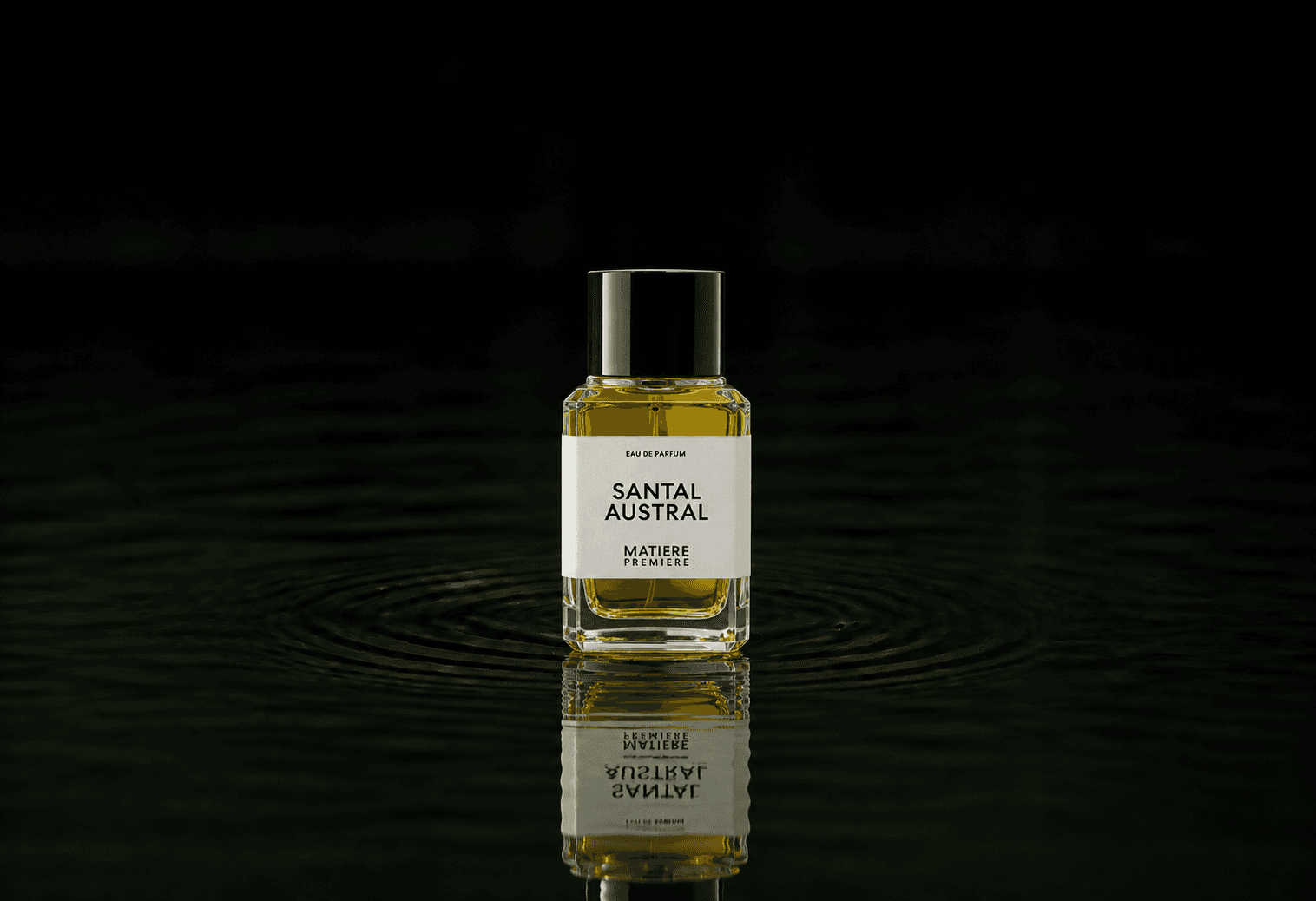 Matiere Premiere Santal Austral fragrance bottle floating above dark water