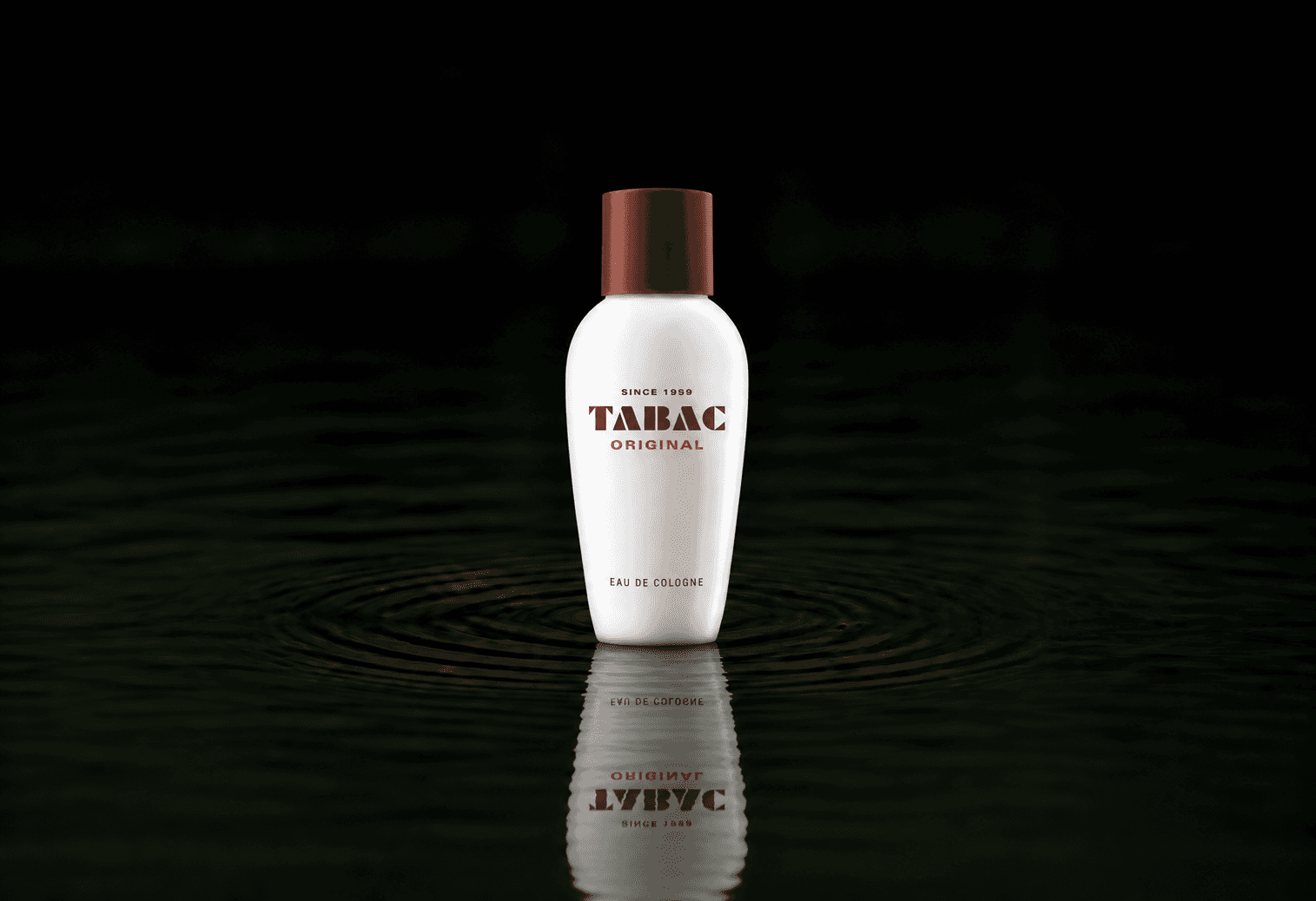 Maurer & Wirtz Tabac original fragrance bottle floating above dark water