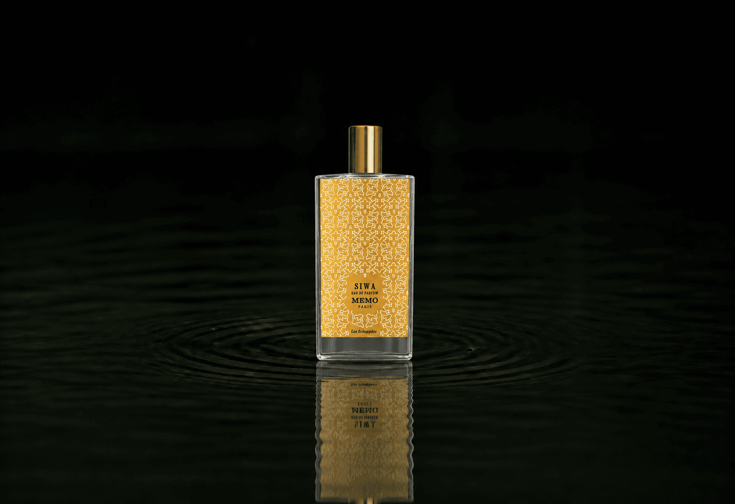 Memo Paris Les Echappées - Siwa fragrance bottle floating above dark water