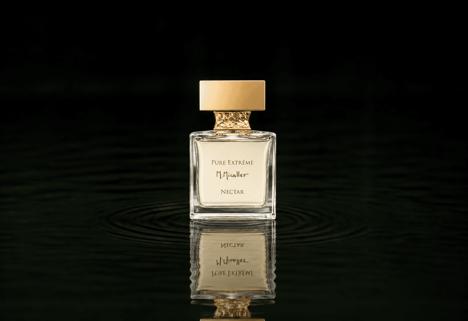 Micallef Pure Extreme Nectar fragrance bottle floating above dark water
