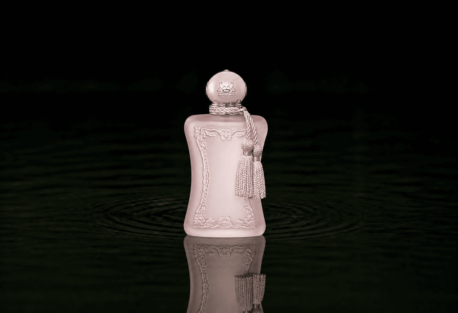Parfums de Marly Delina La Rosee fragrance bottle floating above dark water