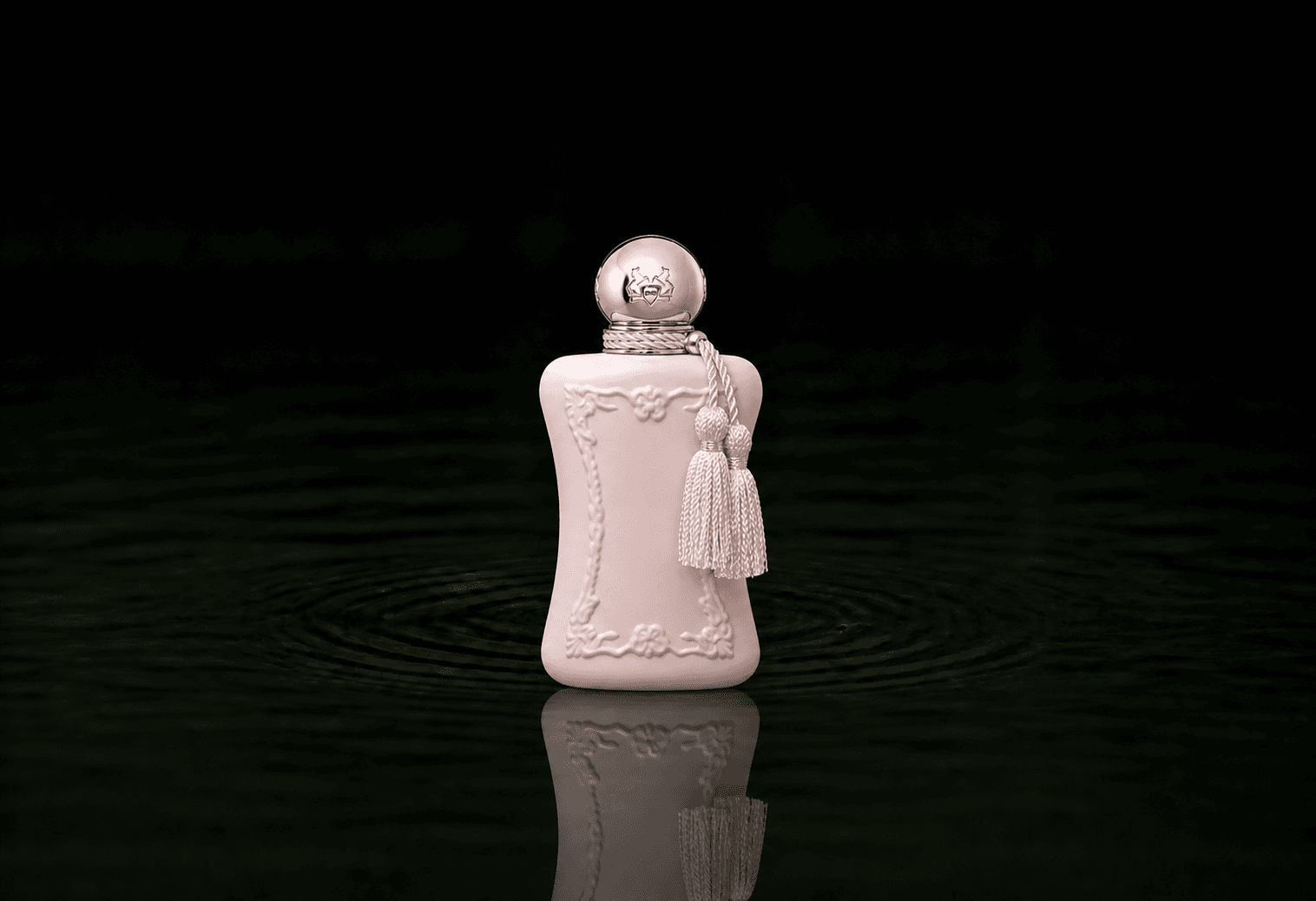 Parfums de Marly Delina fragrance bottle floating above dark water
