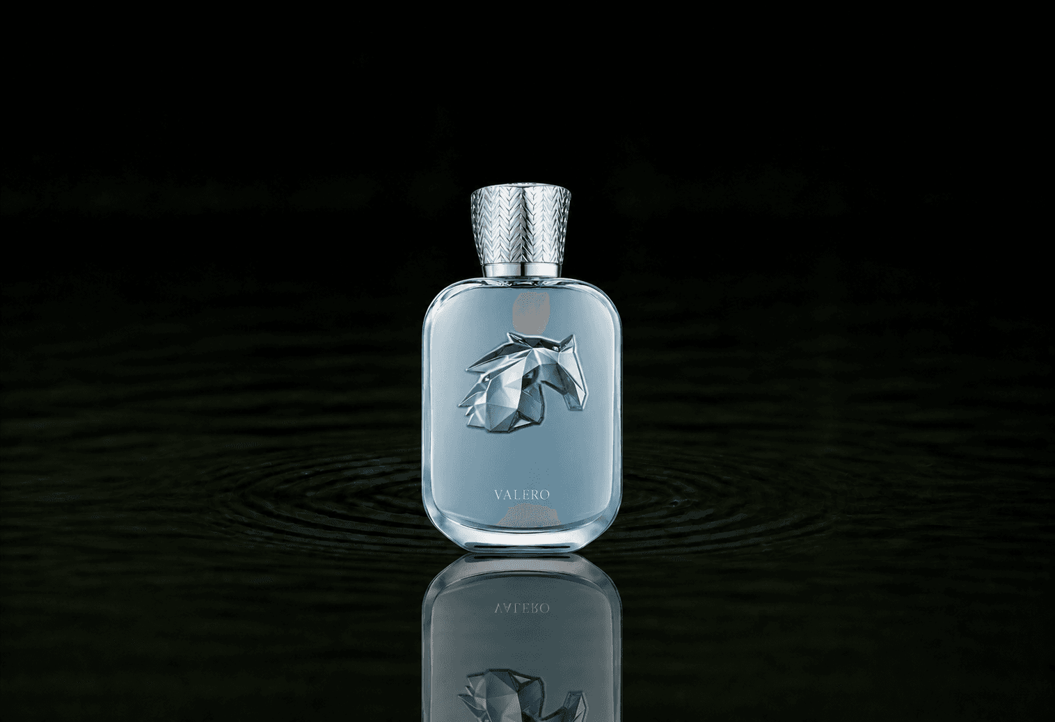 Parfums de Marly Valero fragrance bottle floating above dark water