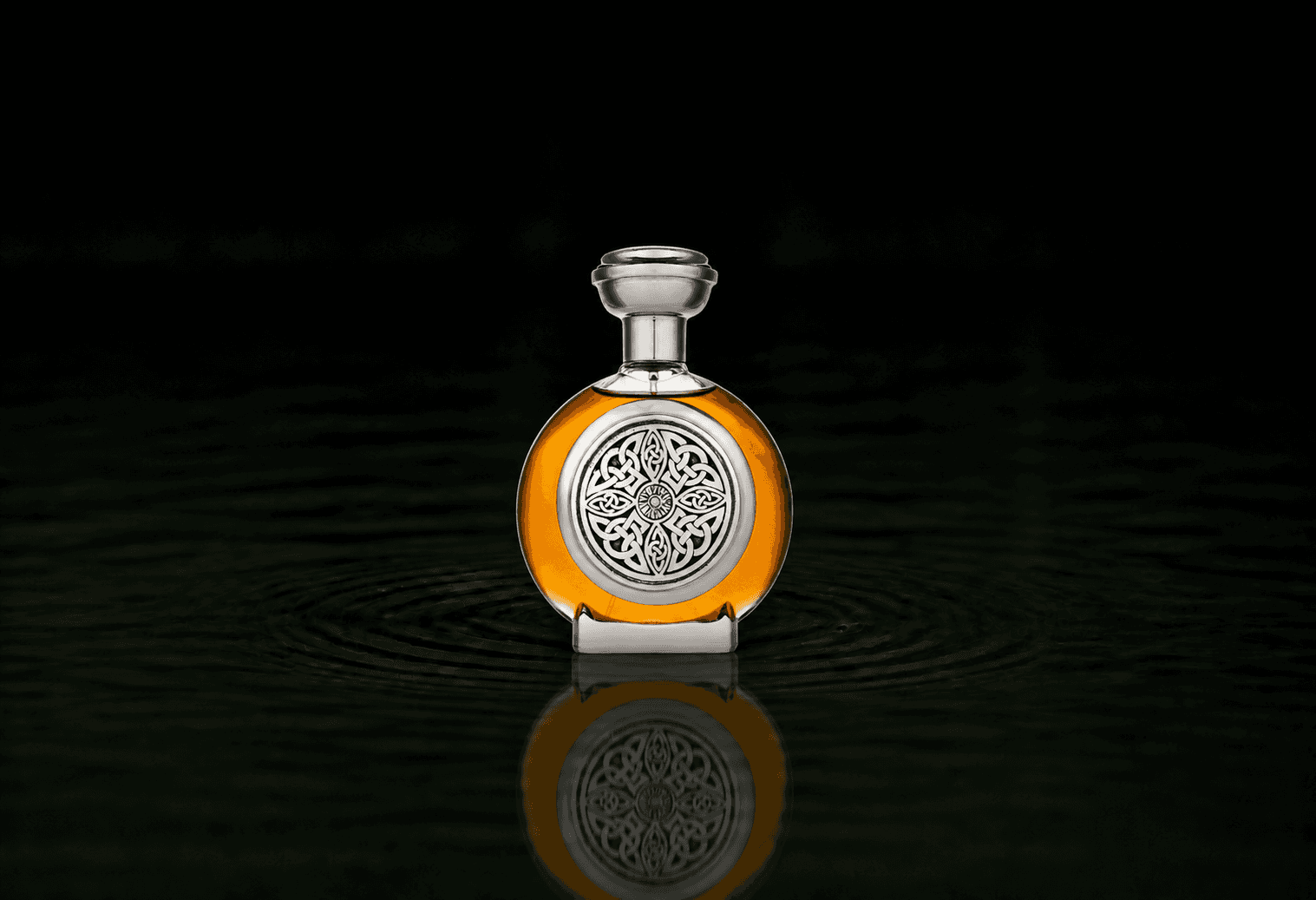 Boadicea The Victorious Almas parfum fragrance bottle floating above dark water