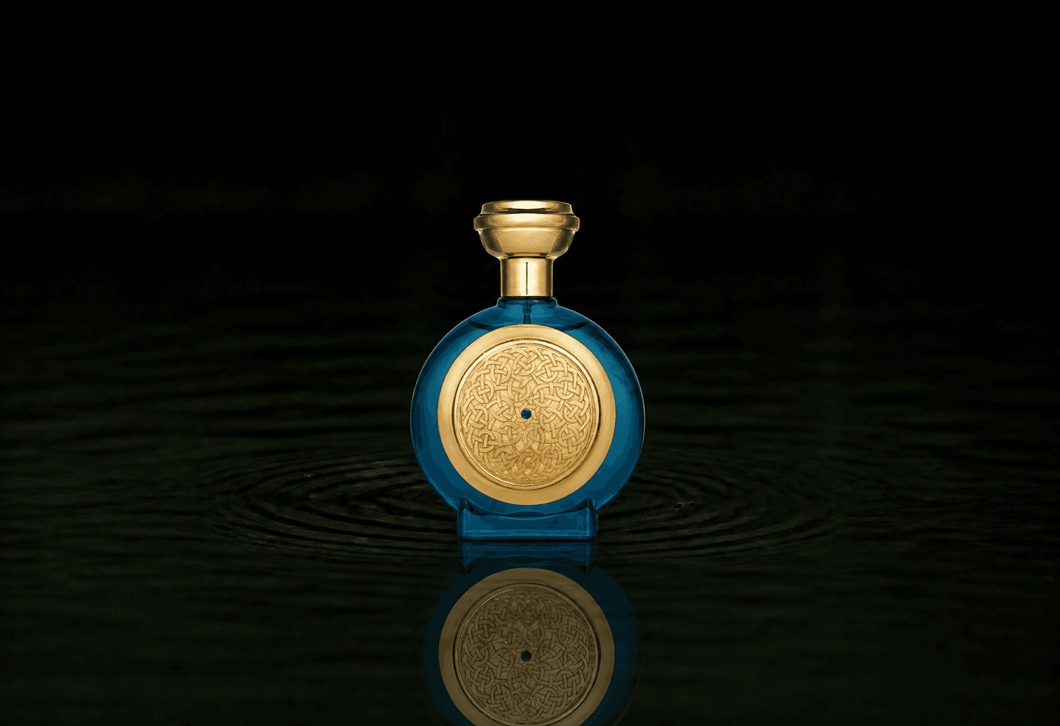 Boadicea The Victorious Aqua Sapphire fragrance bottle floating above dark water