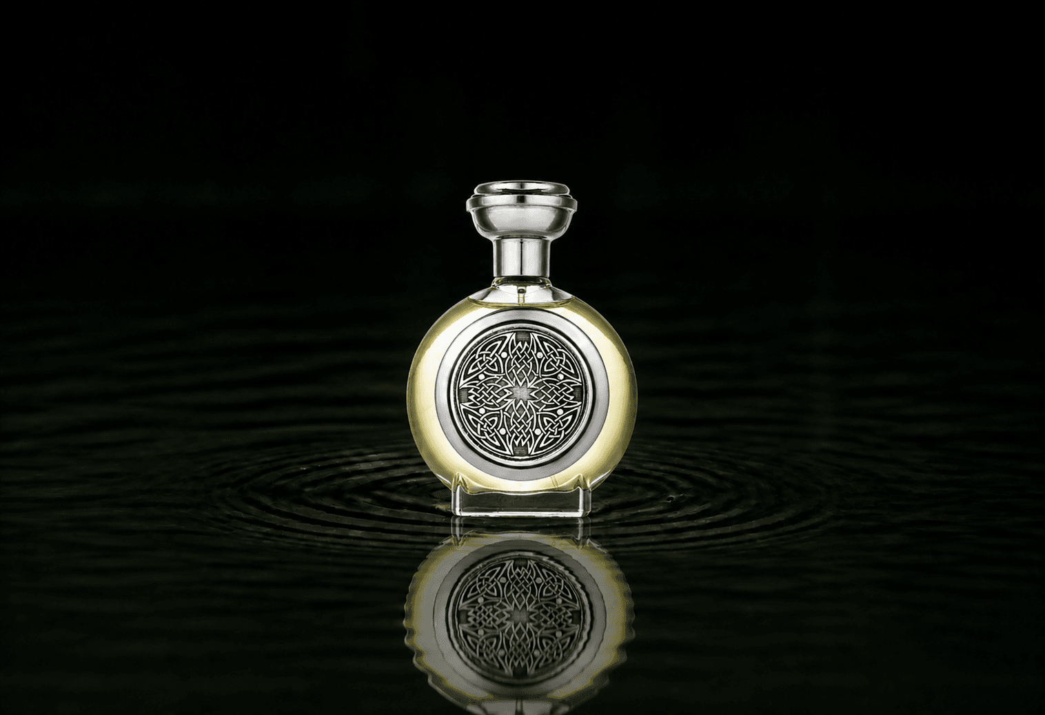 Boadicea The Victorious Ardent fragrance bottle floating above dark water