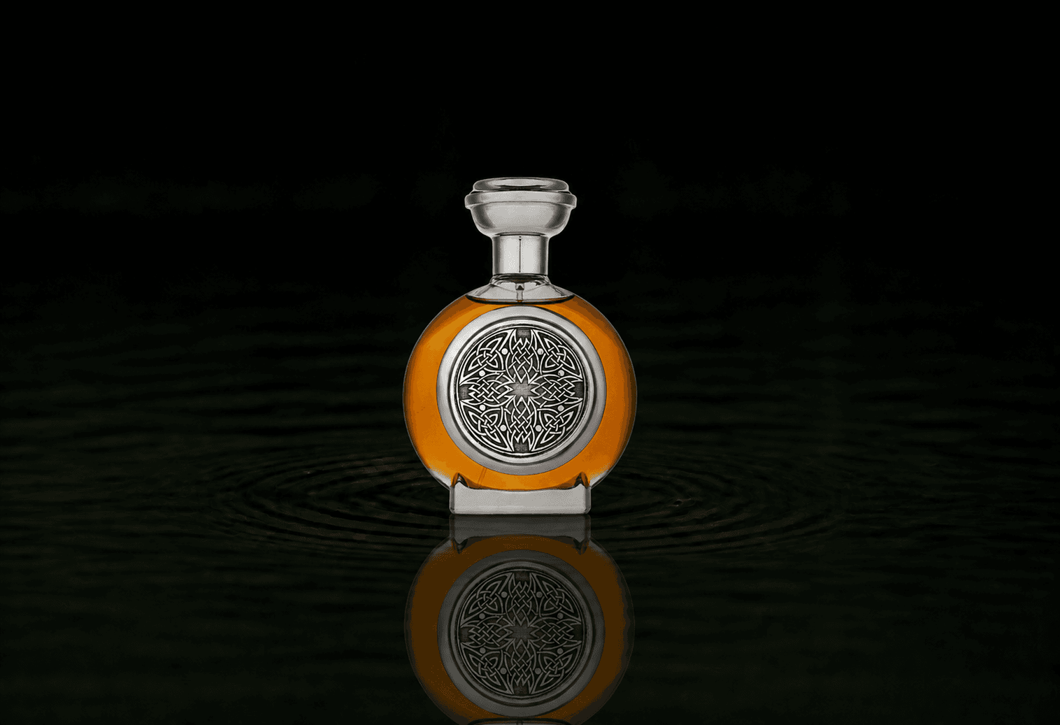 Boadicea The Victorious Bravery fragrance bottle floating above dark water