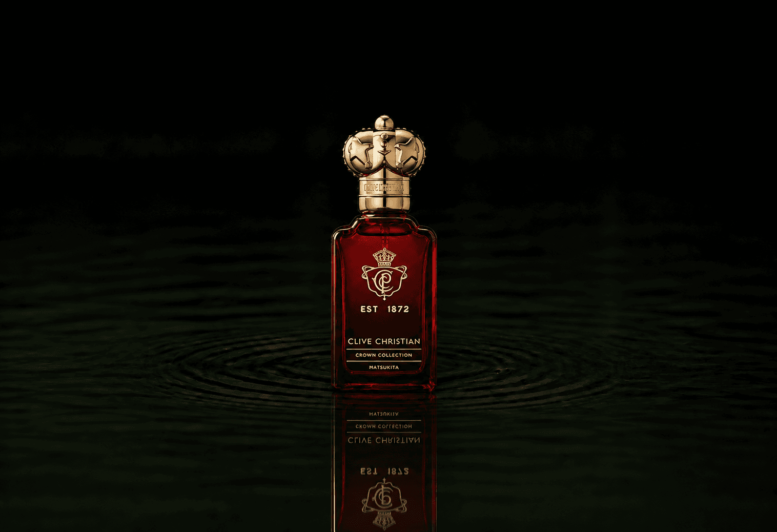 Clive Christian Crown Collection Matsukita fragrance bottle floating above dark water