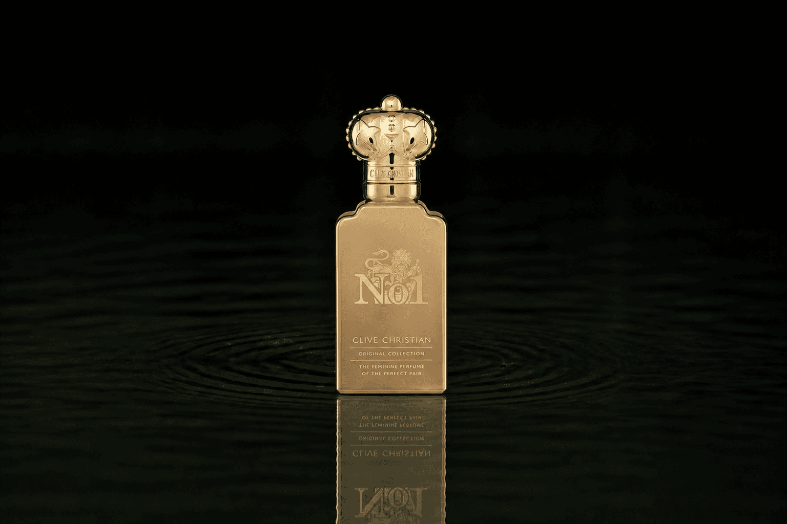 Clive Christian Original Collection No1 Feminine fragrance bottle floating above dark water