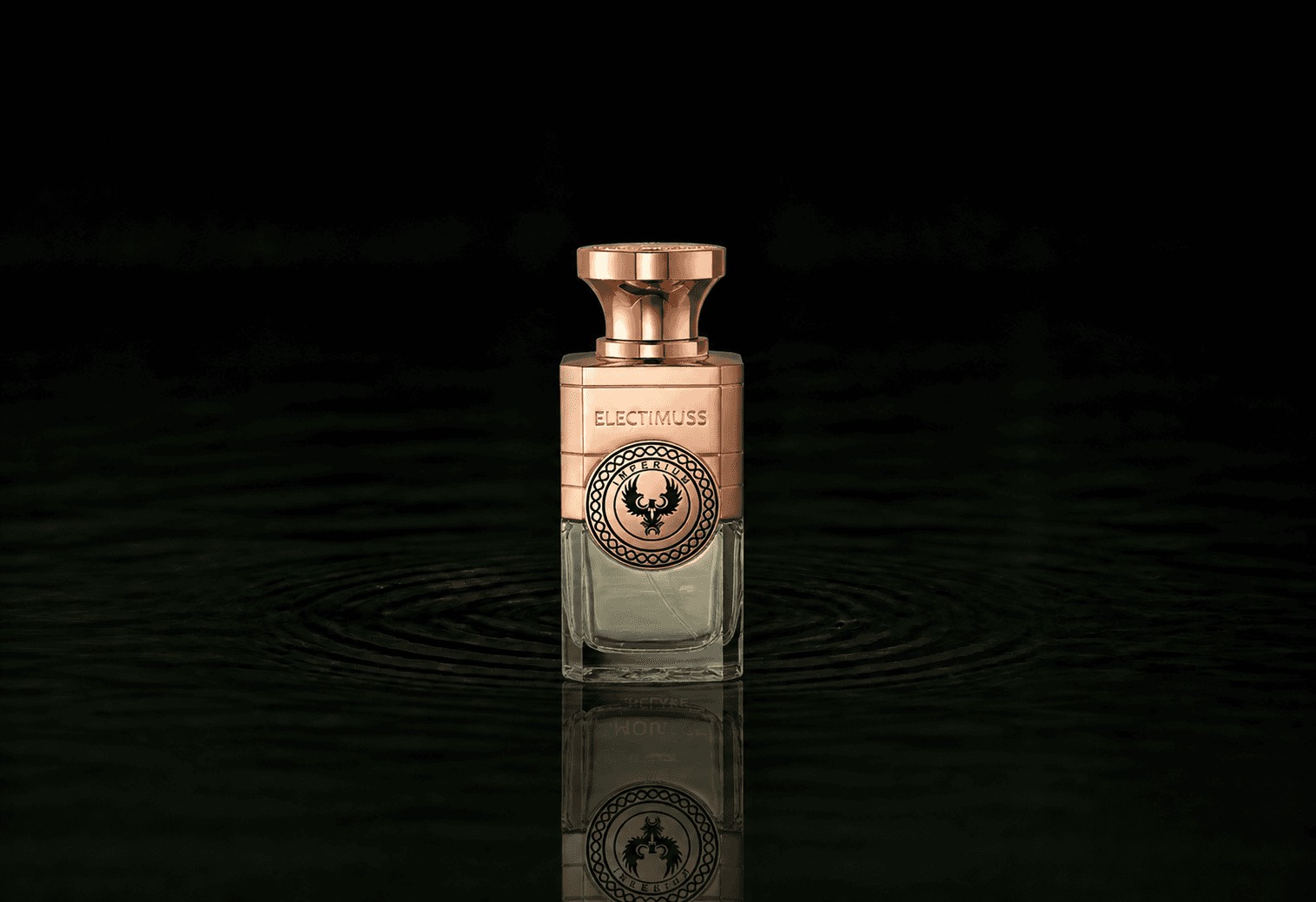 Electimuss Imperium Pure Parfum fragrance bottle floating above dark water